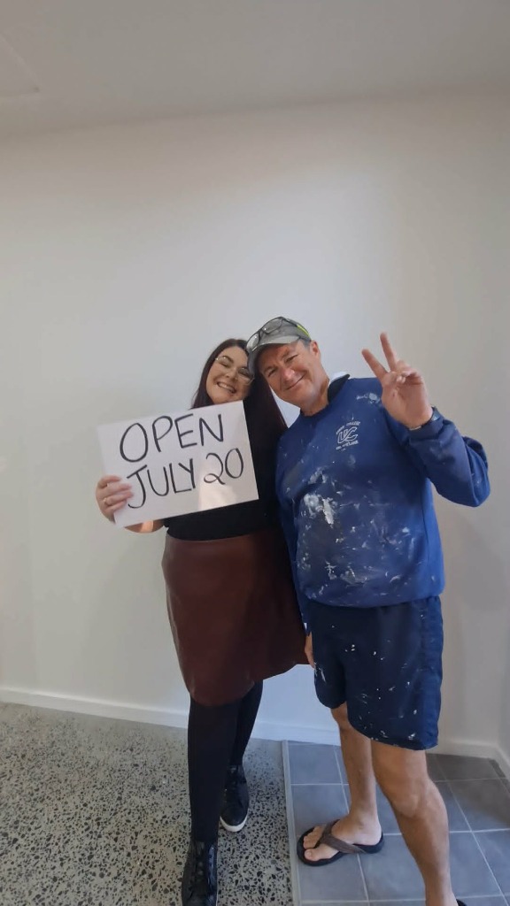 Greg Luke and his daughter Chloe Luke preparing for the opening of Lens Lounge Eyecare in Coffs Harbour