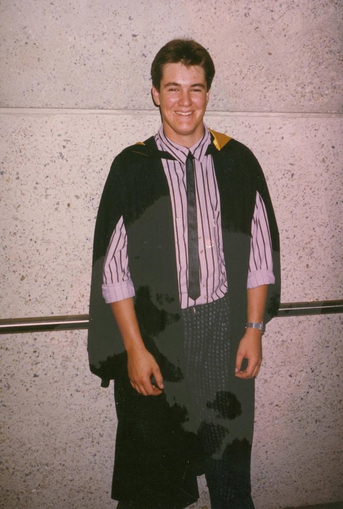 Greg Luke during his optometry graduation in his academic gown
